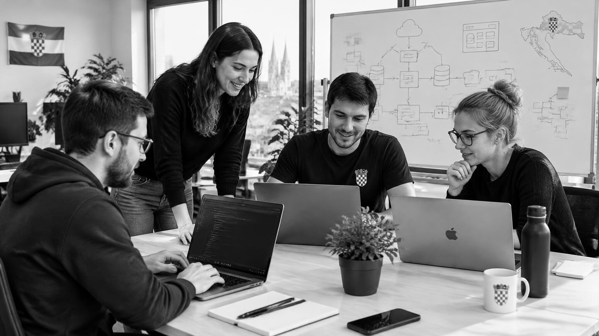 Small team of developers collaborating in a bright open office